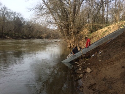 photo of staff installing stair steps in framework