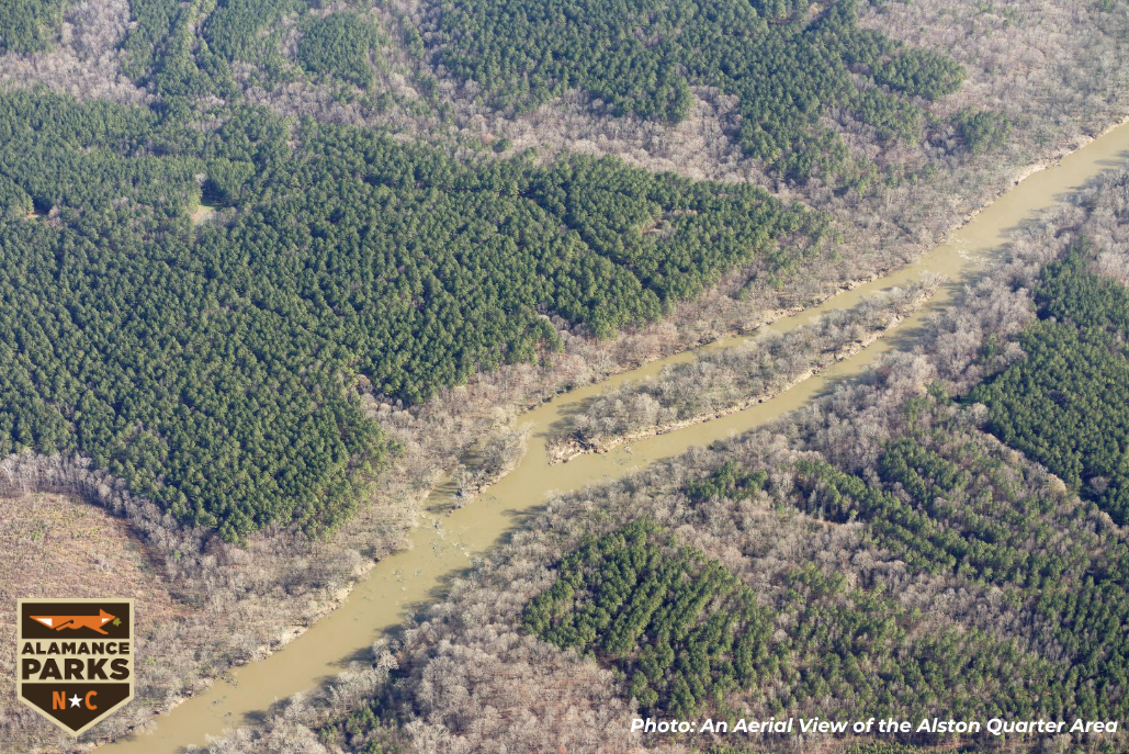 aerial image of vast land and water